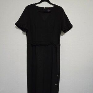 Black short-sleeved jumpsuit by Tommy Hilfiger.